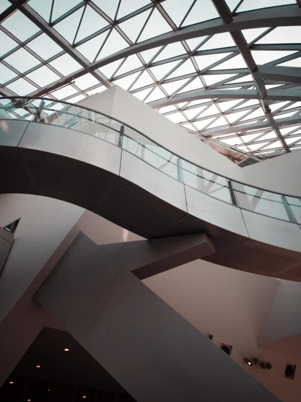 a stainless steel fitted glass roof with a staircase